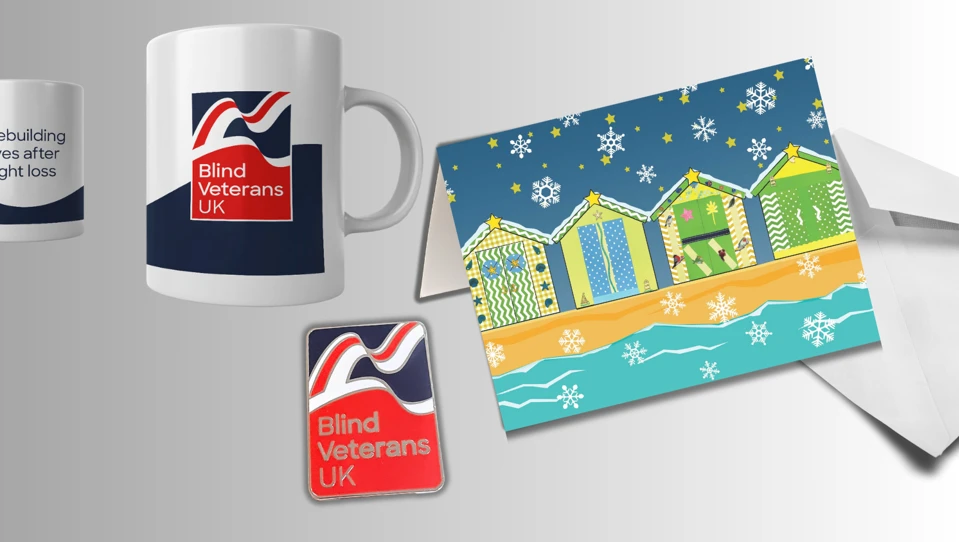 Our Christmas bundle detail containing a mug, pin badge and Christmas card