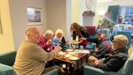 A group of blind veterans tasting mince pies