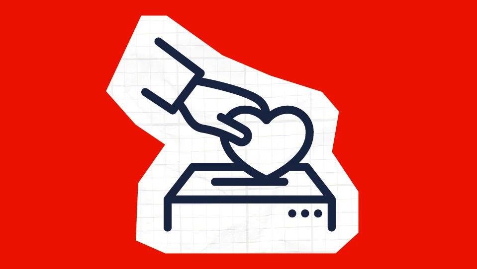 A heart being put in a donation box