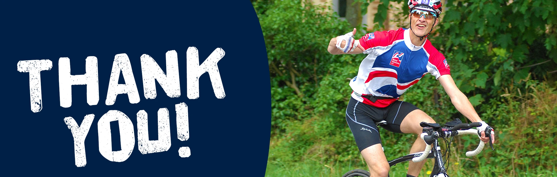 "Thank you!" A photo of a branded supporter riding a bike