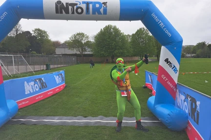 Simon at the start line which is a big inflatable arch. He is wearing his Teenage Mutant Ninja Turtle costume.