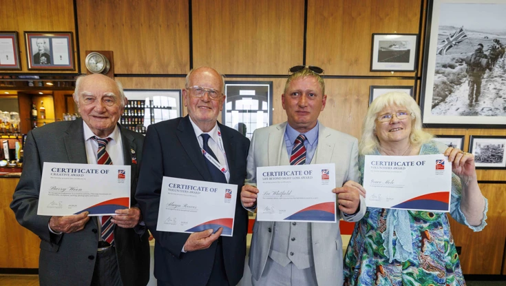 Founder's Awards winners holding their certificates at the HMS Drake Military Dinner