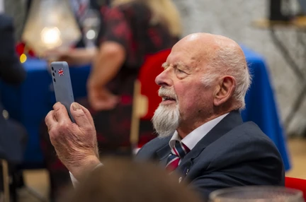 A photo of blind veteran Peter using a phone