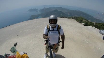 A photo of blind veteran Roan at the top a mountain