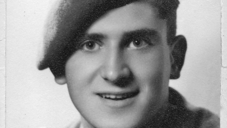 A black and white photo of Geoffrey Barker in Service