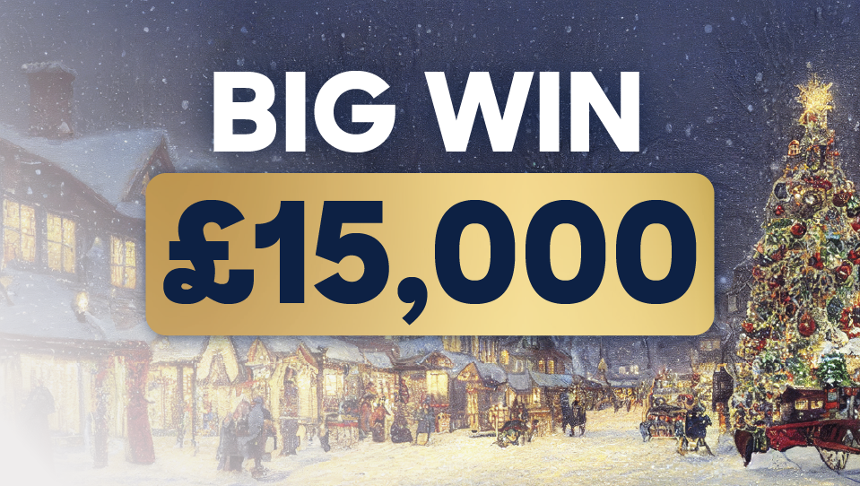 Image showing a snow time village lit up at night with festive lights for the BIG WIN Christmas Raffle