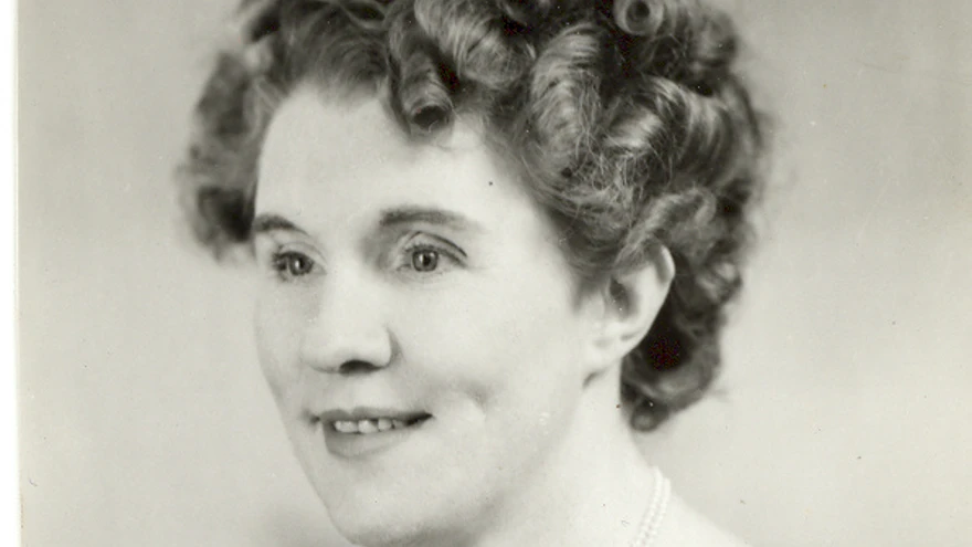 Black and white portrait photograph of Gwen Obern smiling