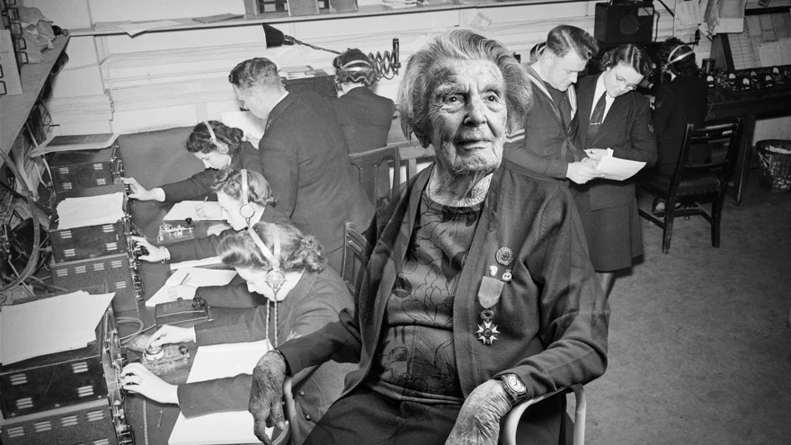A black and white portrait of blind veteran Peggy, overlaid on a scene from WWII