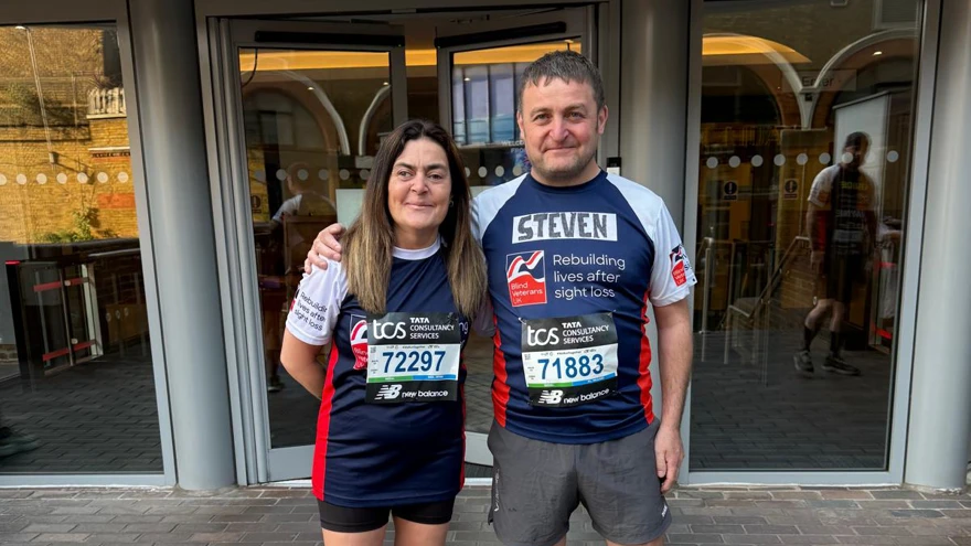 Steve and his sister in their Blind Veteran UK T-shirts with their arm around each other