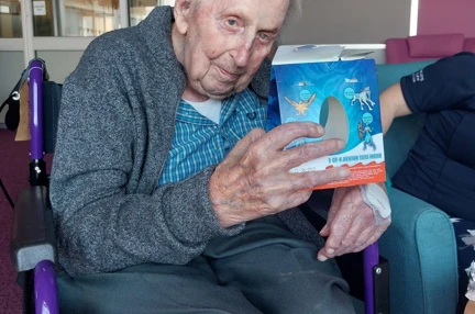 Blind veteran Ken holding a Kinder Surprise Maxi Easter Egg