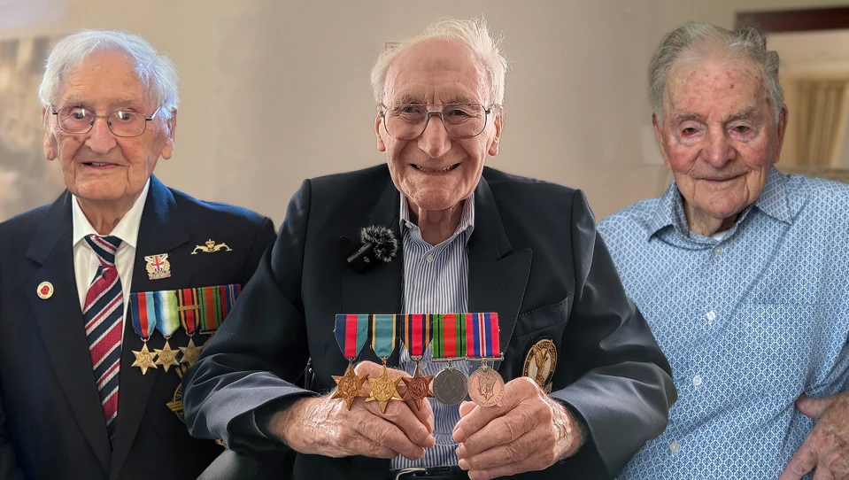 A photo of three blind veterans John, Douglas and Raymond