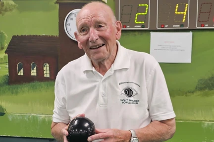 Blind veteran Les holding one of his bowls