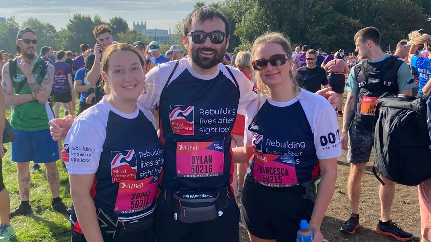 Sophie, Dylan and Francesca with their arms around each other, smiling for the camera ahead of the race.