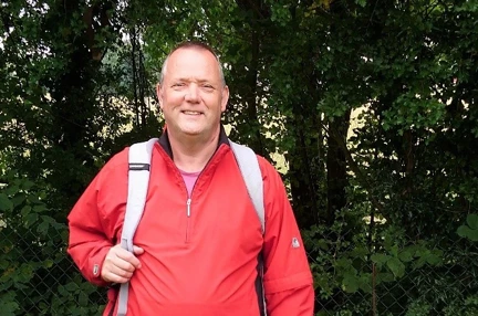 Nigel stopped to pose for a picture during his fundraising walk with his trusty dog sat by his side