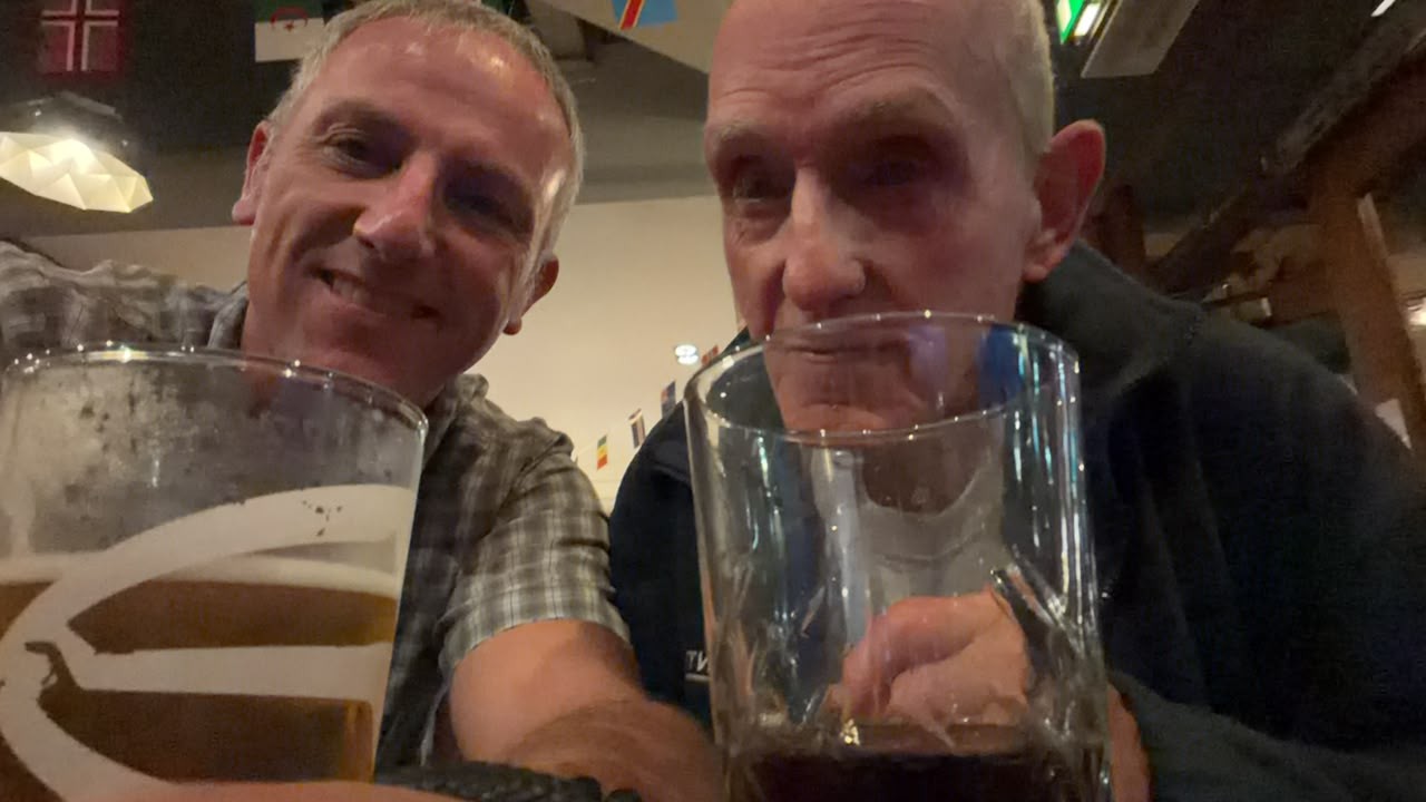 John and Gary enjoying drink after climbing Ben Nevis