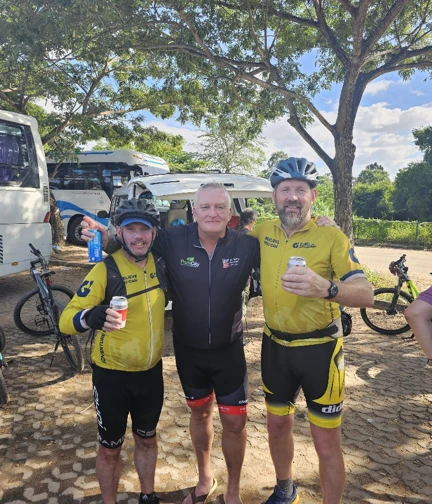 Colin stood between two of the guides that led the challenge. All in cycling shorts and cycling tops