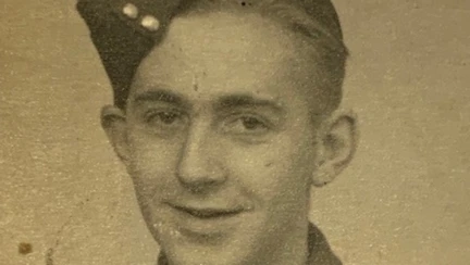 Blind veteran Ken is in black and white and looking into camera