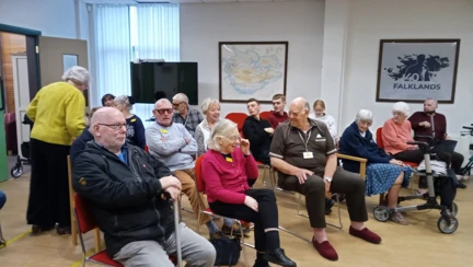 A small group of men and women sat down