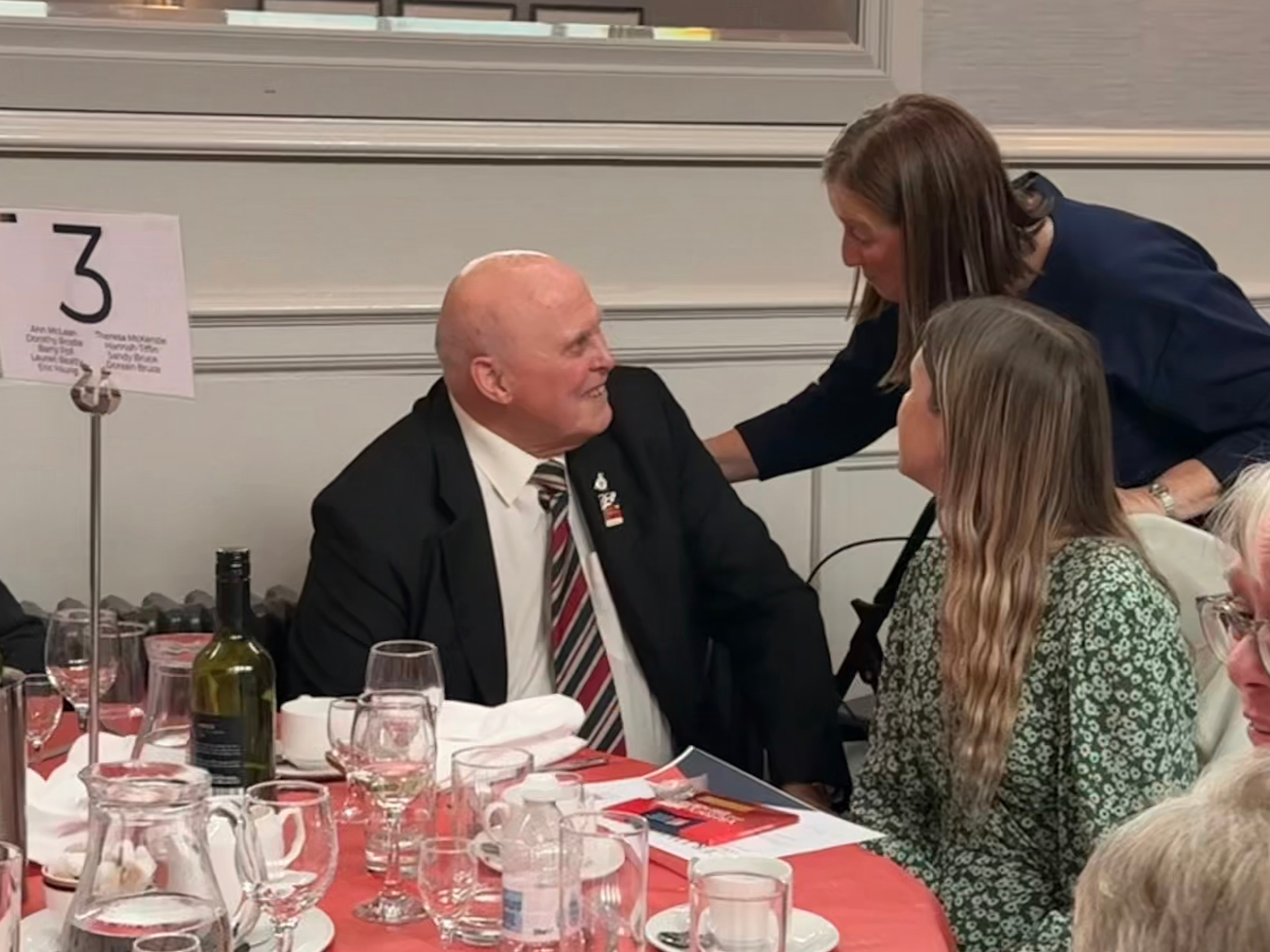 CSW Karen leaning in to speak to Barry and Lauren