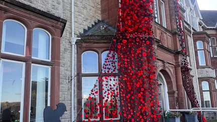 Llandudno Centre entrance with Poppy Blanket - side view