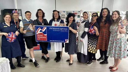 A group picture of staff from SpaMedica in their 1940s outfits