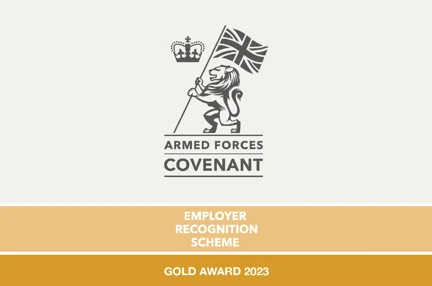 A lion plants a Union Jack flag into the ground and the text reads 'Gold Award 2023' in white on a gold background