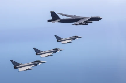 A picture of four planes in the sky