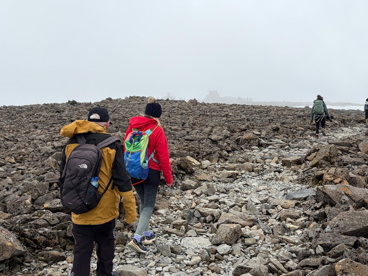 John during the climb making his way over very rocky terrain