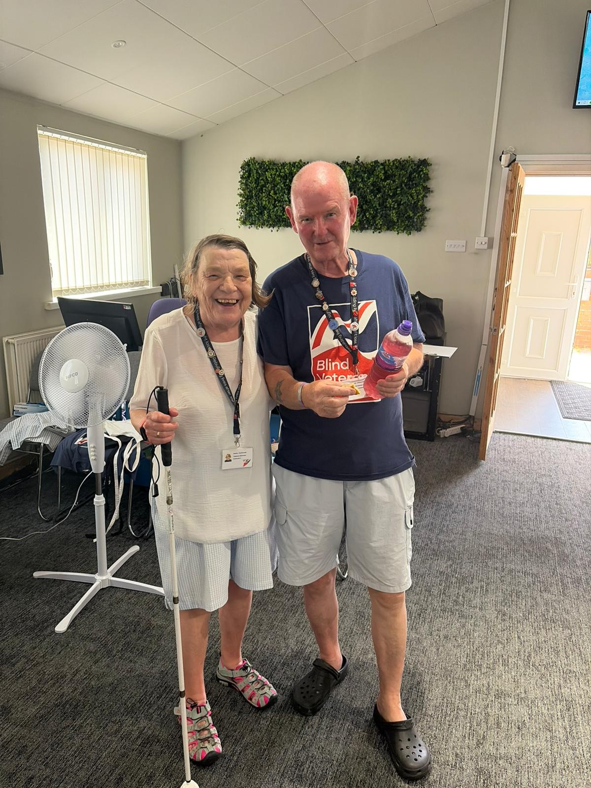 Noeline and John standing together during their coffee morning