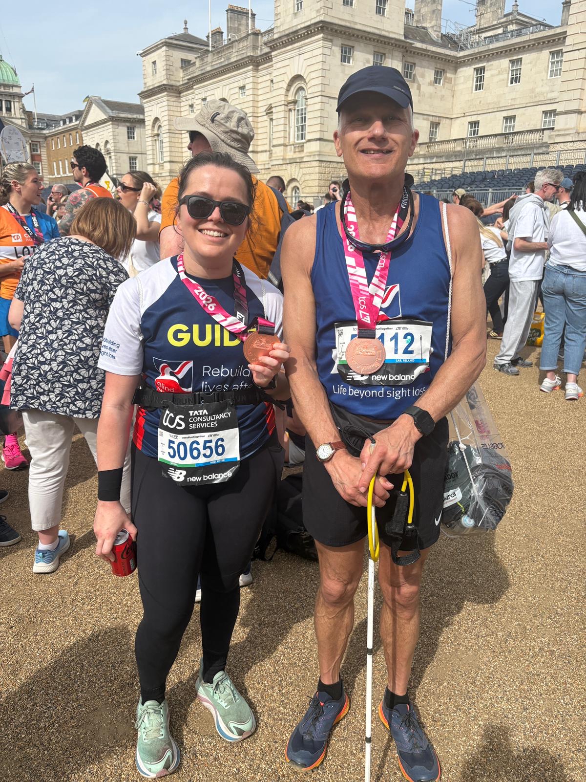 Chris and Phoebe with their medals just after finishing