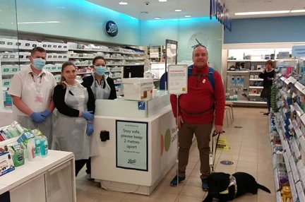John with his guide dog during lockdown
