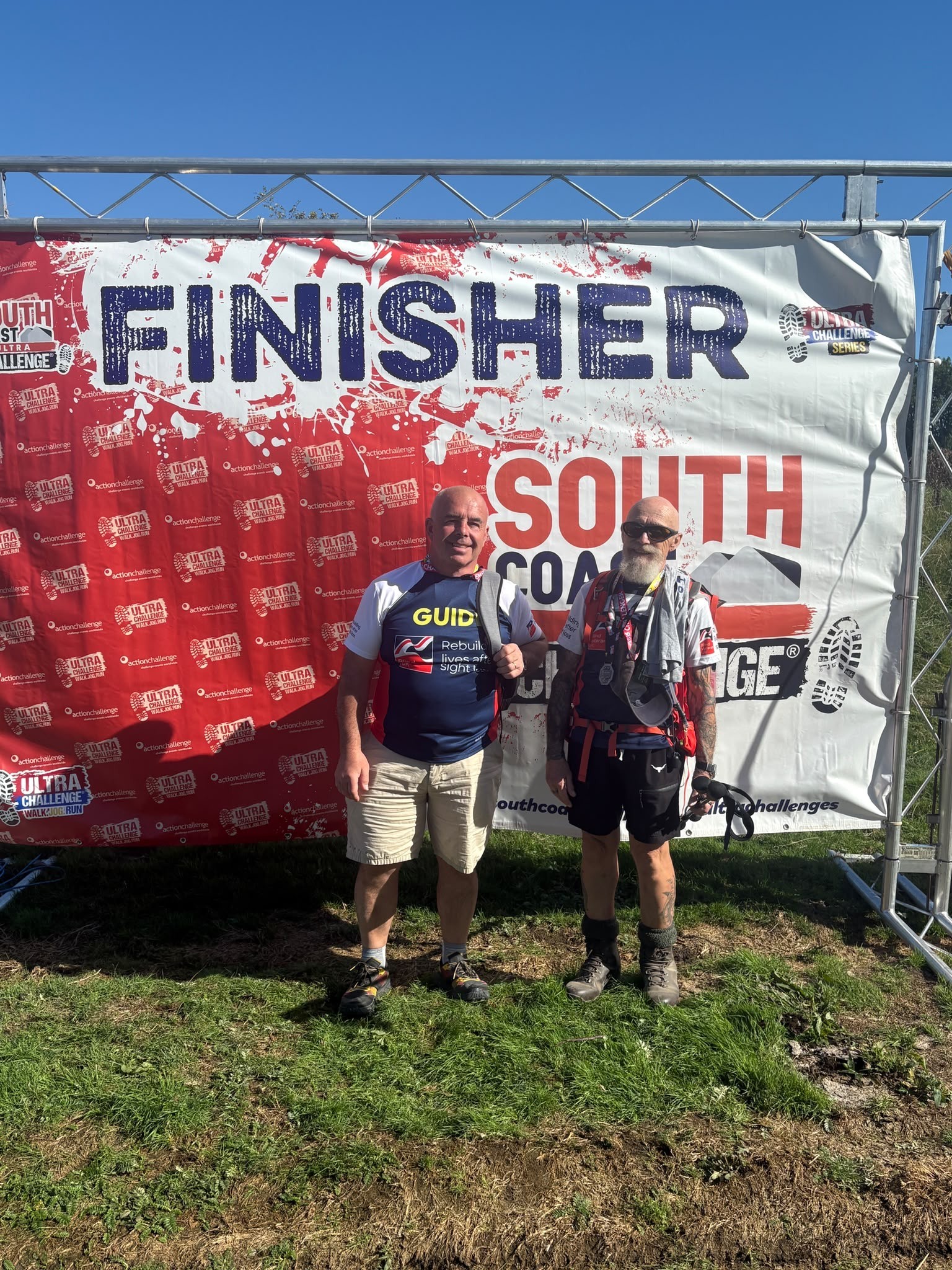 Jeff and Paddy at the finish backdrop