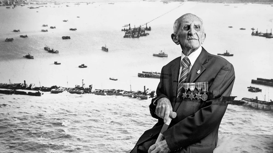 A black and white portrait of blind veteran Joe, overlaid on a scene from D-Day
