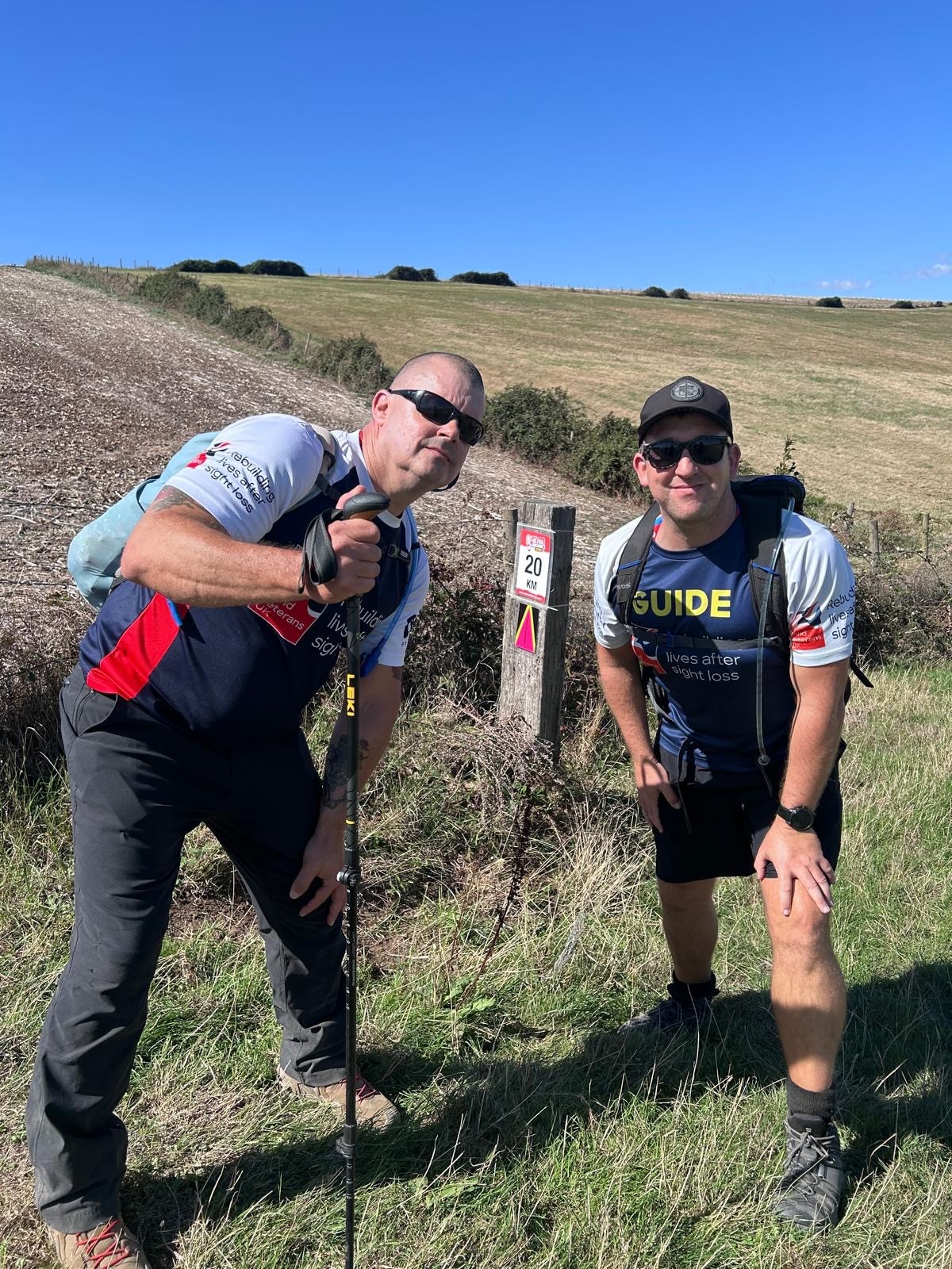 Stu and Rich pose for a photo at the 20km marker