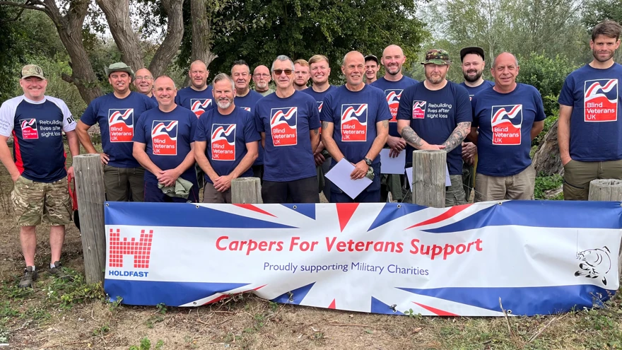 Group photograph of the Carpers for Veterans Support team and competitors all wearing their Blind Veterans UK t-shirts