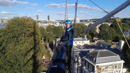 A photograph of Kelso taken by another person on the yard arm with him. In the background are the views across London