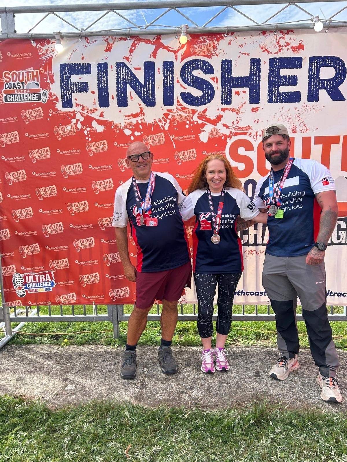 Jerry, Anne and Jack at the finish banner