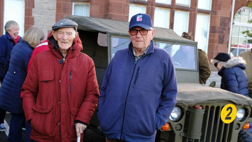 Blind veterans stood in front of a World War Two military vehicle outside the Llandudno Centre of Wellbeing