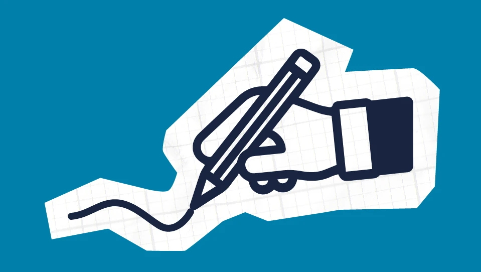 A hand holding a pen