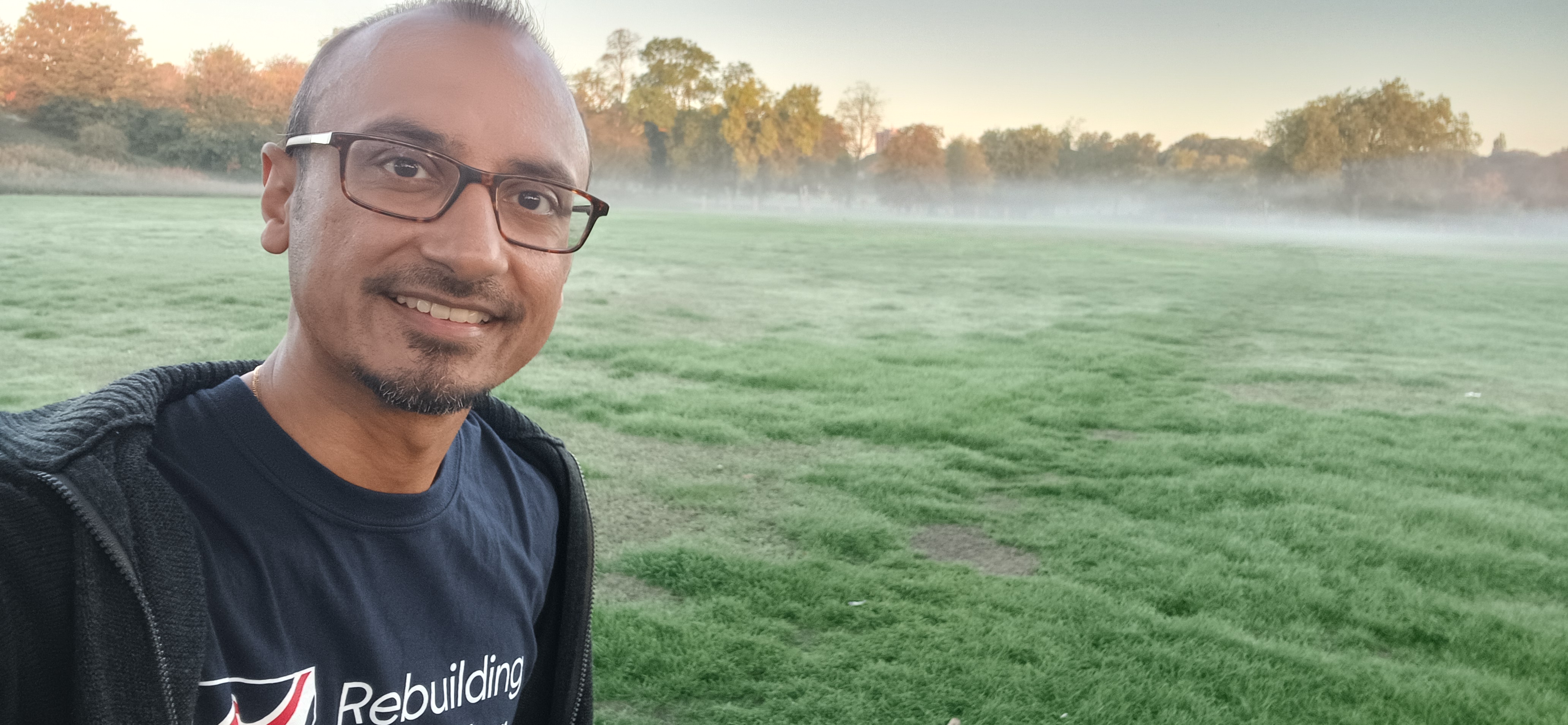 Nav standing in a misty field during an early morning walk