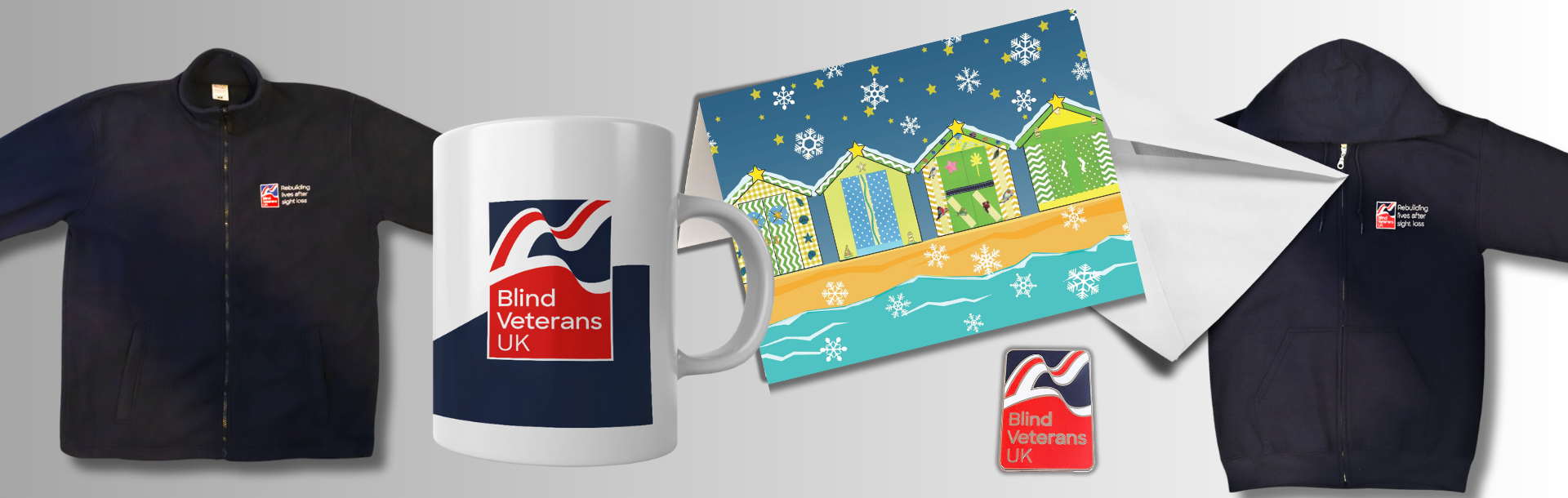 Online shop banner with a compilation of items for sale including our hoodie, mug, fleece, Christmas cards and badge