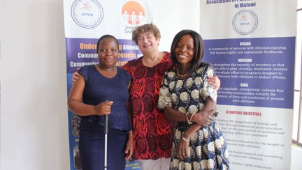 Photo showing Penny, centre, amidst fellow blind cooks In Lilongwe, Malawi