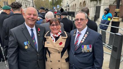 Blind veteran Andy (right) with his wife and guide and another guide waiting to start the march past the Cenotaph