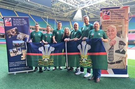 A photo of Royal Welsh team members with Wales Fundraiser (centre) and ex Welsh rugby captain Ryan Jones (second from right)