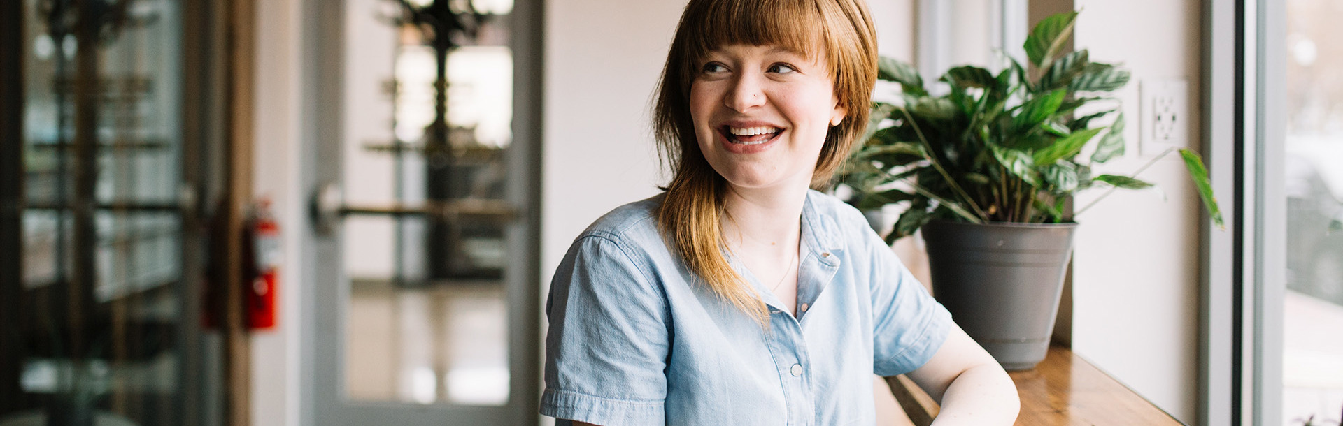 A small business owner smiling