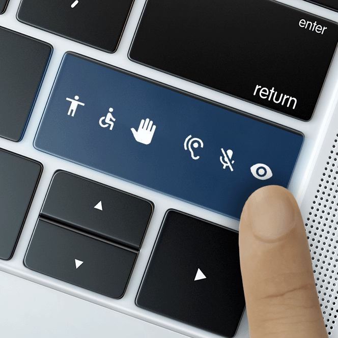 A finger pressing a button on a keyboard that features a selection of accessibility icons