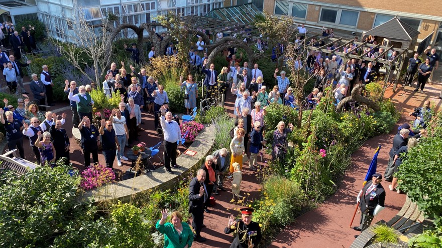 200 guests gather in the Blind Veterans UK inner garden at Ovingdean