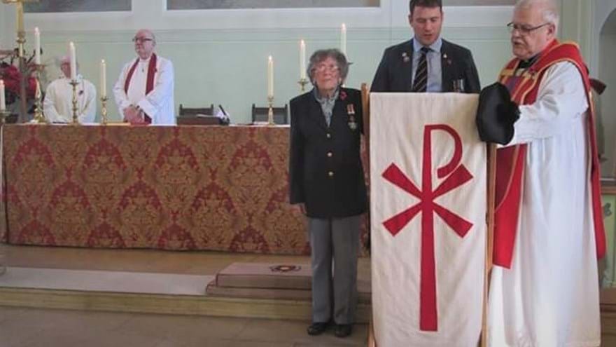 Photo of blind veteran Florence, left, and volunteer Luke, right at the 2019 Remembrance service