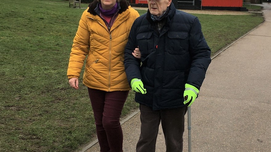 Blind veteran Colin and his daughter, walking laps around a park to raise money