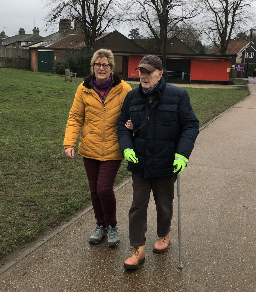 Blind veteran Colin and his daughter, walking laps around a park to raise money
